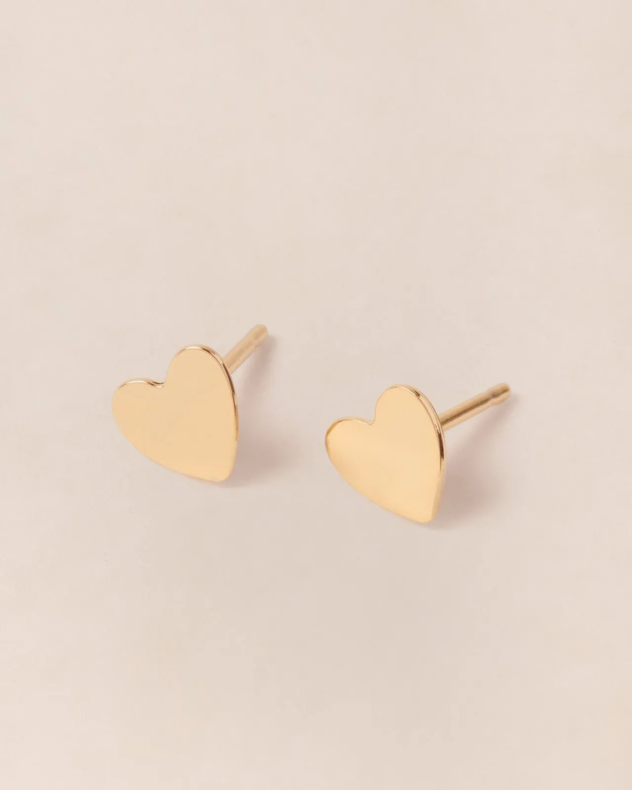 Les boucles d'oreilles petits cœurs Doré