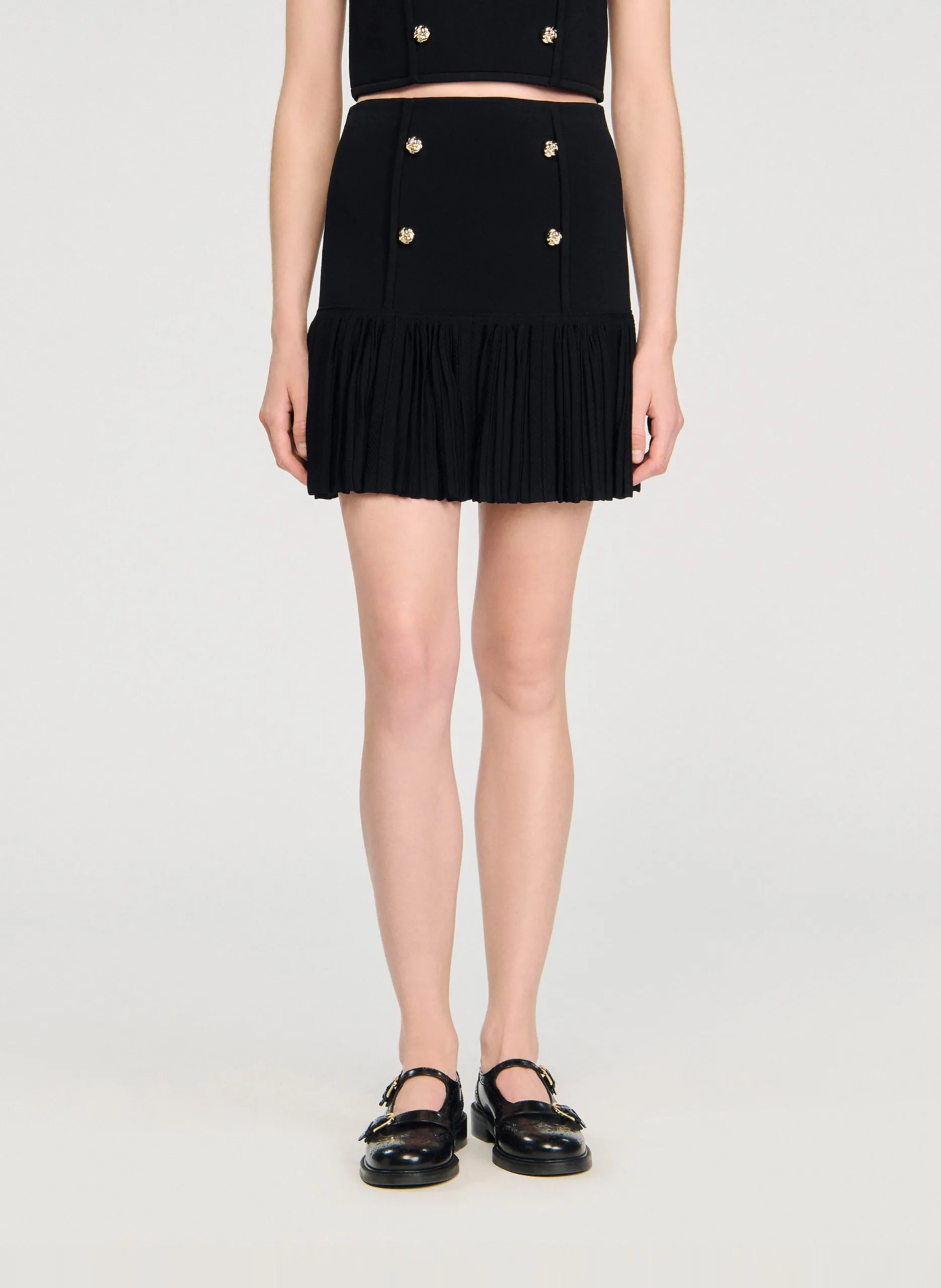 Jupe courte plissée en maille Noir