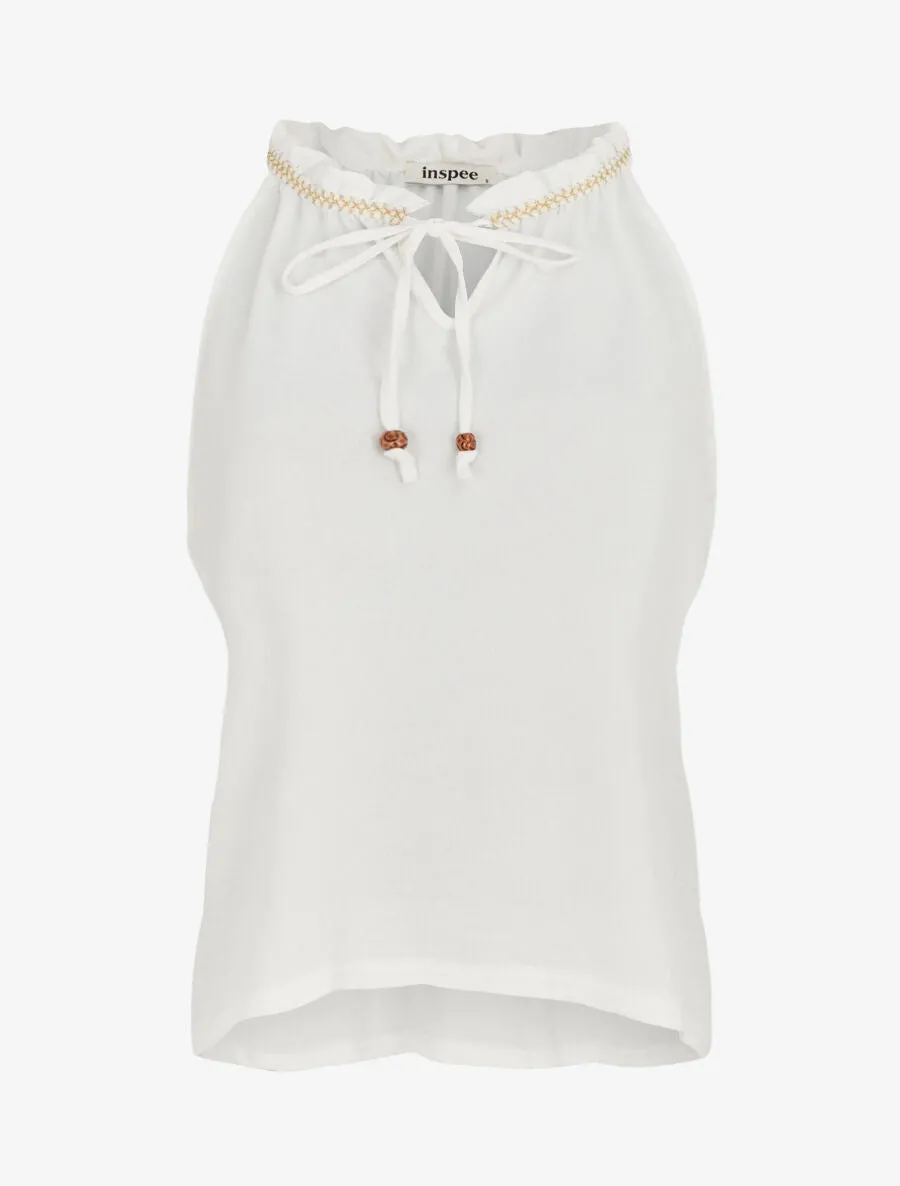 Top uni à col V et détail brodé - Blanc